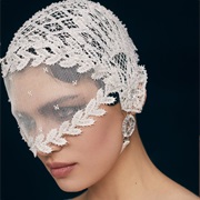 Lace Cap With Attached Veil Over Eyes