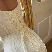 Corset Lacing With Ruffles Along Sides