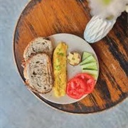 Multigrain Sourdough Bread With Scrambled Eggs, Parmesan, and Red Curry Paste