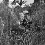 Armand Denis and Wife in Jungle Grass (Thurston Hopkins)