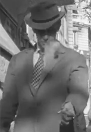 Jean-Paul Belmondo Flipping a Cigarette in Breathless (1960)