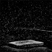 Snow Falls Outside a Shuttered K-Mart (Matt Black)