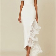 Ruffles Sticking Out From Asymmetrical Skirt Opening