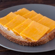 Sesame Sourdough Bread With White Honey Butter and Marble Cheddar
