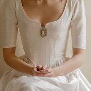 Cameo Brooch on Wedding Dress Bodice