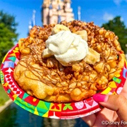 Funnel Cake With Chocolate-Hazelnut Spread, Bananas, and Whipped Cream