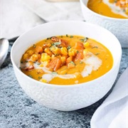 Butternut Squash Soup With Corn, Boiled Egg, Cranberry Sauce, and Parmesan