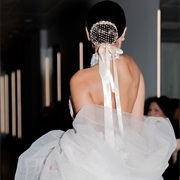 Beaded Bun Cover With Ribbon Hanging Down