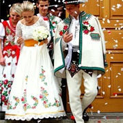 Traditionally Decorated Apron Over Wedding Dress