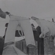 Washing in Road Between Terraced Housing (Humphrey Spender)
