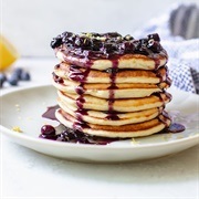 Pancakes With Dark Blue Berry Syrup