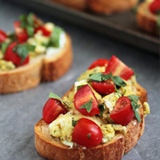 Scrambled Egg Cheese and Tomato Toast