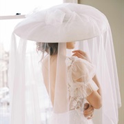 Round Veil Hanging off Large Hat