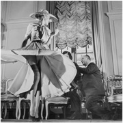 Christian Dior With Woman Modeling Dress and Stockings