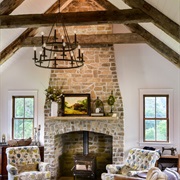 Brick Fireplace Up to Vaulted Ceiling