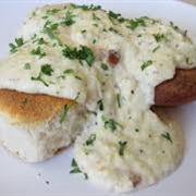 Sesame Sourdough Bread With Scrambled Eggs, Chicken Gravy, and Parmesan