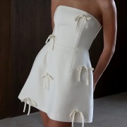 Bows Scattered Over Dress