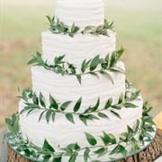 Wedding Cake Decorated With Greenery