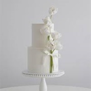 Cake With Bouquet Attached to Side