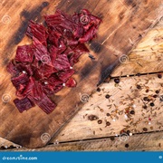 Cured Meat Crisps on Reclaimed Forest Wood