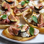 Burrata, Prosciutto, and Fig Crostini