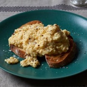 Pumpernickel Bread With Scrambled Eggs, Parmesan, and Red Bell Peppers