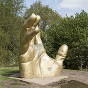 The Golden Hand Sculpture