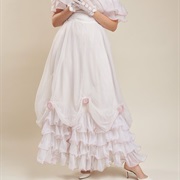 Fabric Swag With Rosettes Over Ruffle Hem