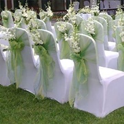 Chairs With Covers and Flowers