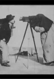 At the Photographers (1900)