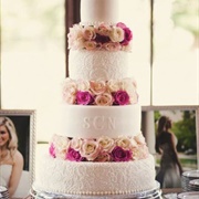 Flowers Between Tiers of Cake