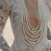 Round Plunge Neckline Covered by Pearl Strands