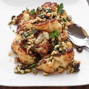 Whole Roasted Cauliflower With Caramelized Pine Nuts and Raisins
