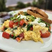 Sesame Sourdough Bread With Scrambled Eggs, Parmesan, and Red Bell Peppers