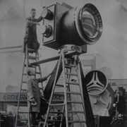 Two Workers Set Up a Giant Ernemann Camera