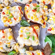 Multigrain Sourdough Bread With Chili, Tomato, and Red Onion Creamed Corn