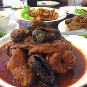 Ayam Masak Buah Keluak (Chicken Braised in Spicy Tamarind Gravy With Keluak Nuts)